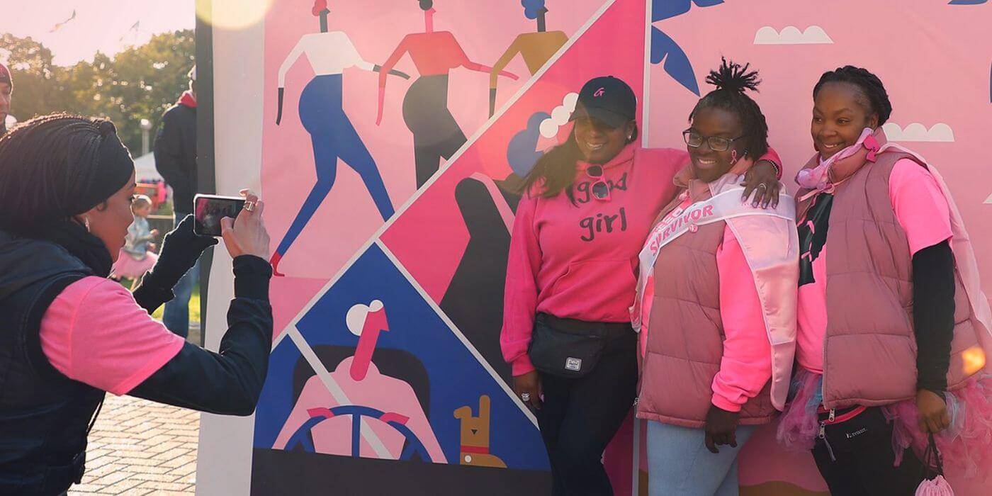 image of 3 women with another woman taking a picture of them