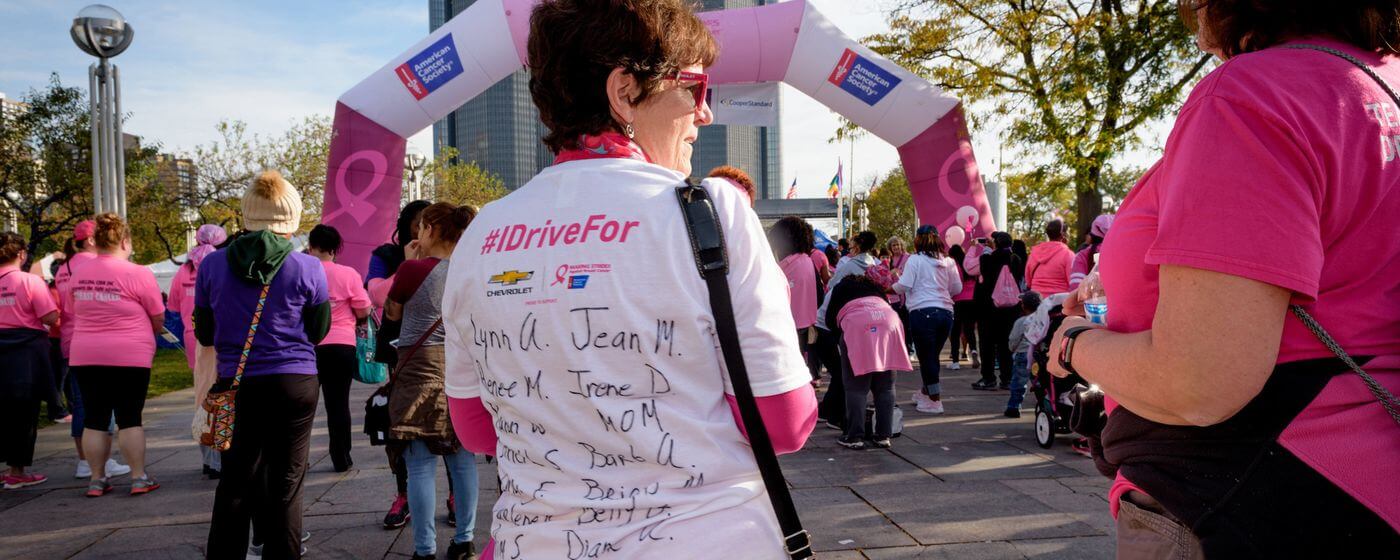 image of the back of a woman's tshirt that has writing on it