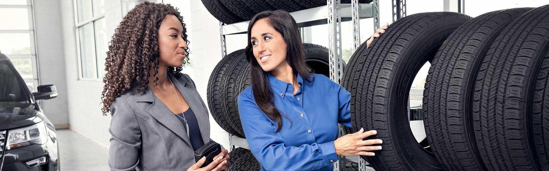Customer and tech with tire