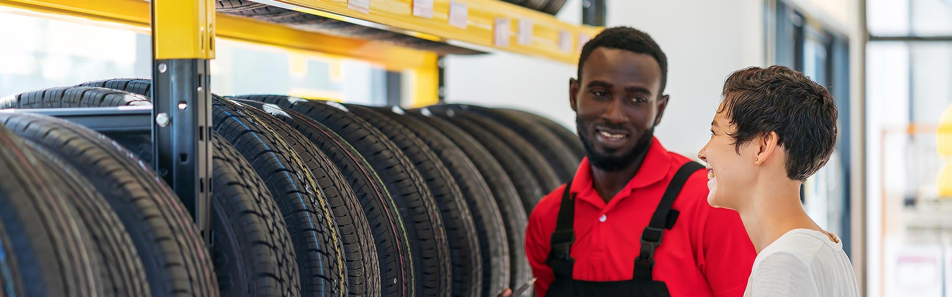 Customer and tech with tire